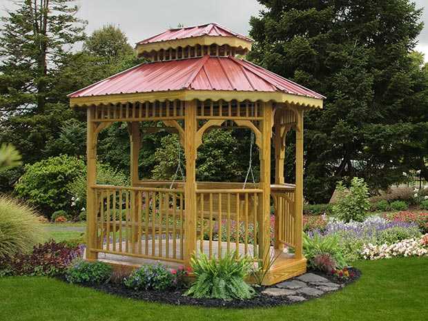 a 7x9 Teahouse with a red roof and a bench and swing