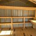 12x24 Classic Metal Utility Shed. Clay Walls Polar White Trim and Bronze Metal Roof. Options Include 80" Double Doors, 4' Loft 2- Windows 6' Wokbench,12' Double Shelves 8x7 Roll-up Door Foil on Roof.
