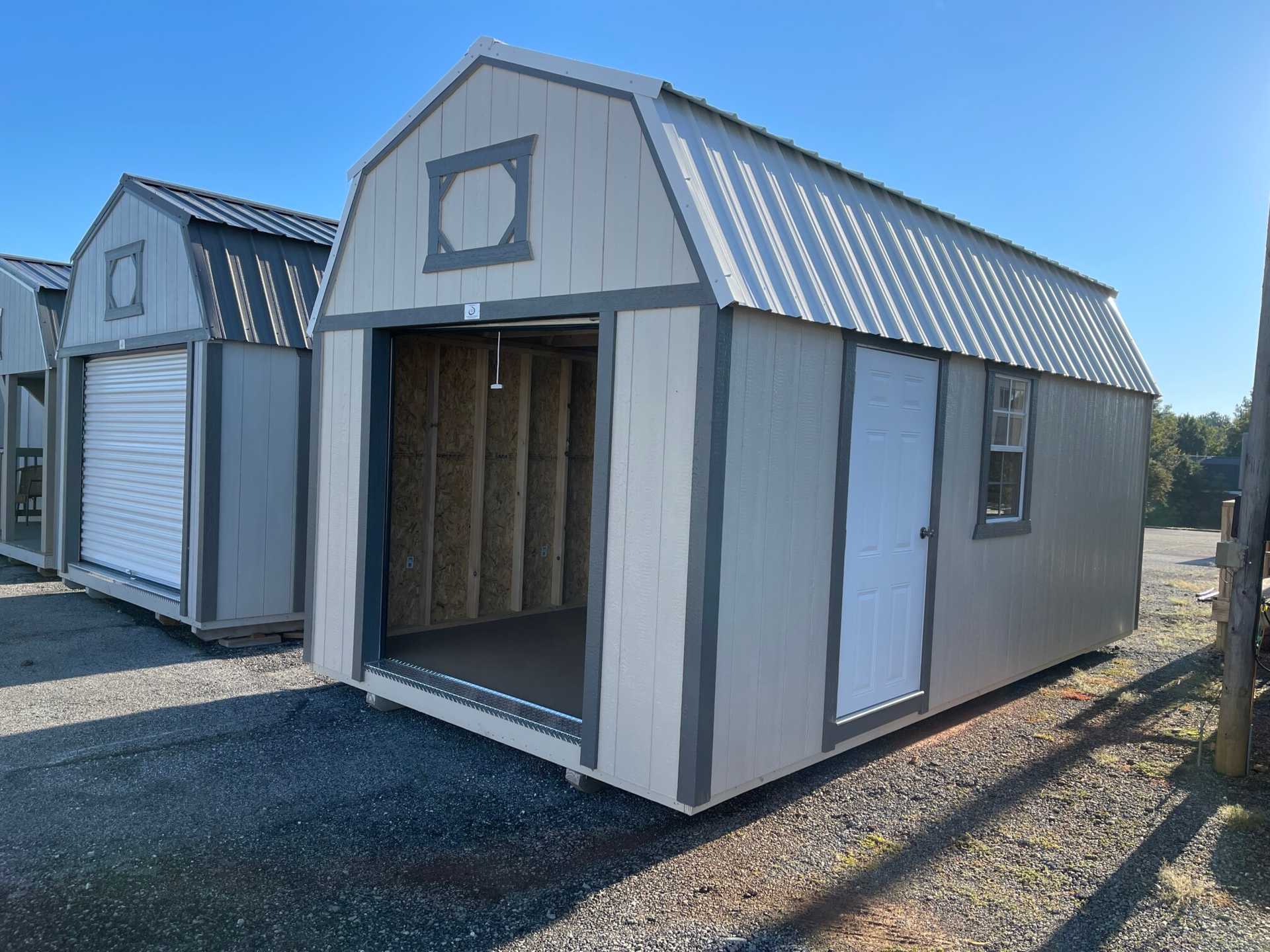 6x7 Rollup Door, 1-(24"x36" Window), 1 (Solid Panel Entry Door), 2 (Lofts w/ 4' Opening Space), 10' (3-Tier Shelving), 8' (Heavy Duty Workbenc