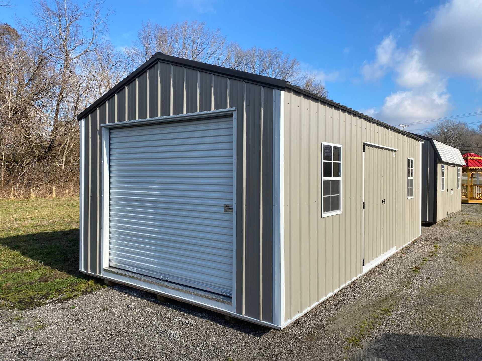 12x24 Classic Metal Utility Shed. Clay Walls Polar White Trim and Bronze Metal Roof. Options Include 80" Double Doors, 4' Loft 2- Windows 6' Wokbench,12' Double Shelves 8x7 Roll-up Door Foil on Roof.