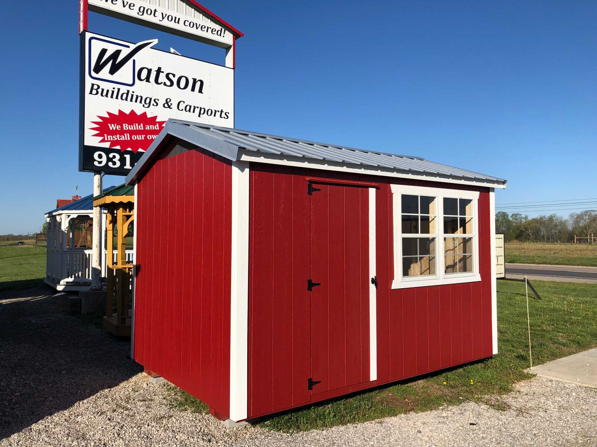8x12 Chicken Coop with windows. Painted Red with White trim and Galvalume metal roof.
