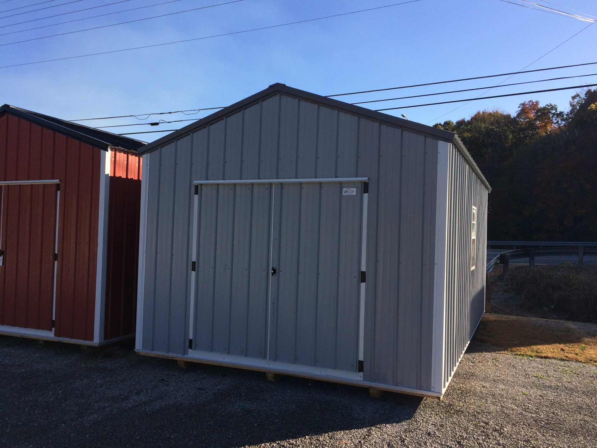 12x20 Metal Utility Shed. Light Gray Walls, Polar White Trim and Charcoal Metal Roof. Includes 80" Doors, 1 - 4' Loft, 12' Double Shelves, 2 - Windows and Fully Insulated.