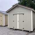 12x16 Utility Shed painted Clay with White trim and Brown metal roof