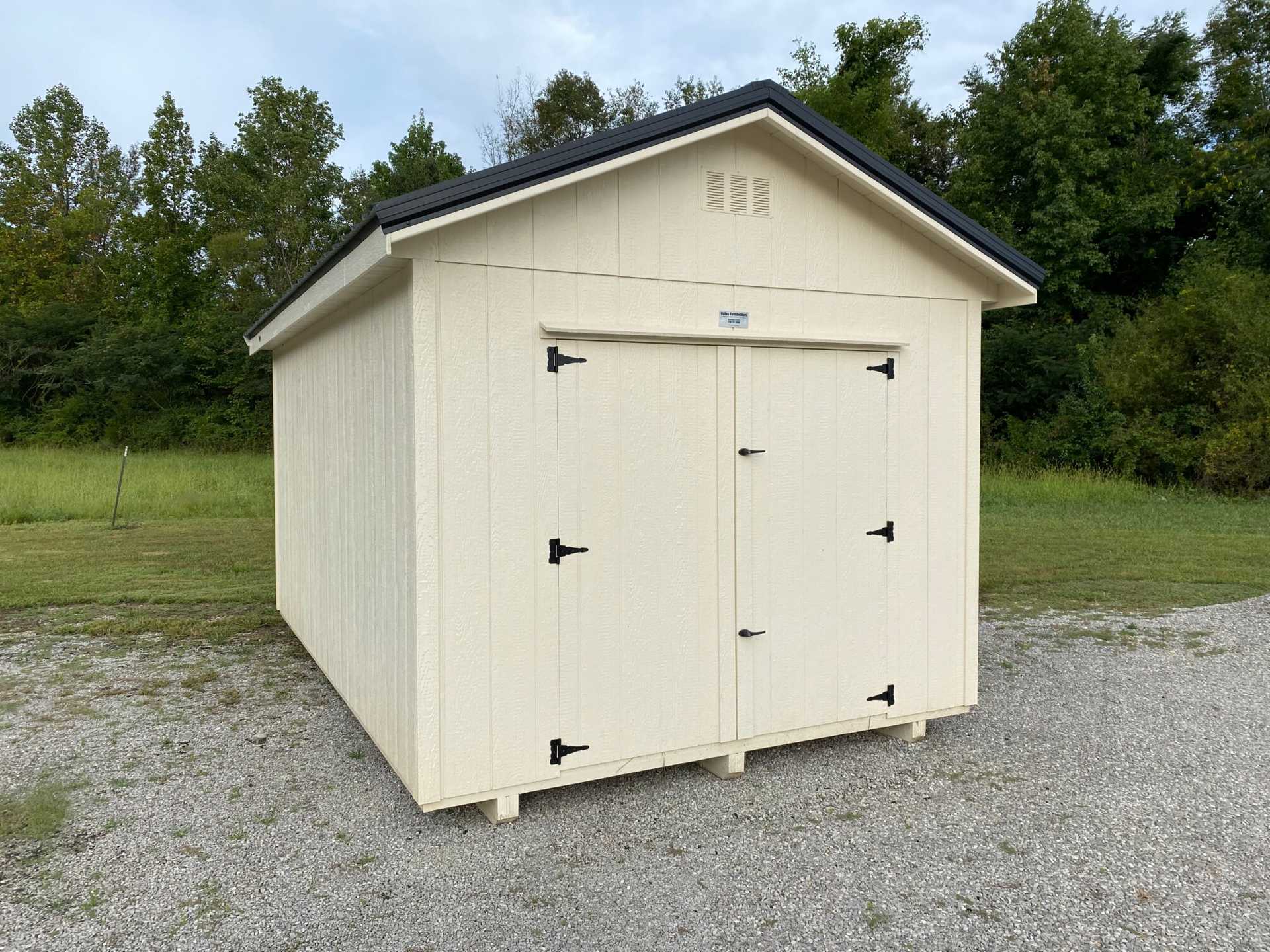 10x16 Premium Wood Utility Shed. Walls Stone, Trim Brown and Brown Metal Roof. Includes 1 - Window, 1 - 4' Loft and Roof Barrier. USED