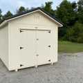 10x16 Premium Wood Utility Shed. Walls Stone, Trim Brown and Brown Metal Roof. Includes 1 - Window, 1 - 4' Loft and Roof Barrier. USED